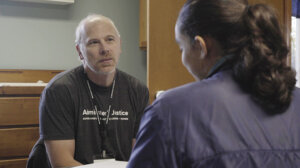 James Poortinga listening to a client at a Gospel Justice Center